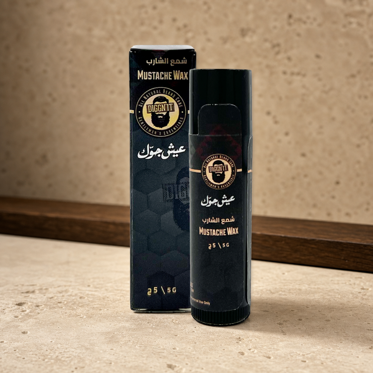 Diggn'It Natural Mustache Wax 5 g stick and carton on a warm mineral surface